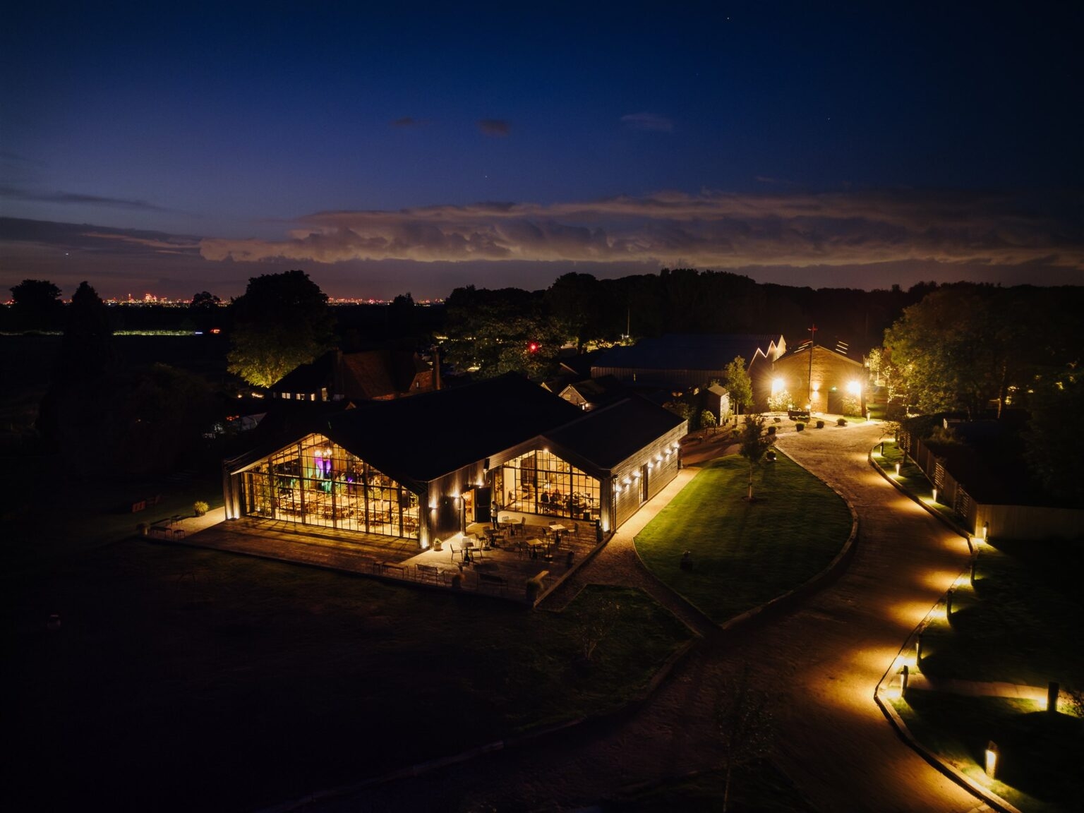 Botley Hill Barn at night, a cool party venue near Oxted in Surrey